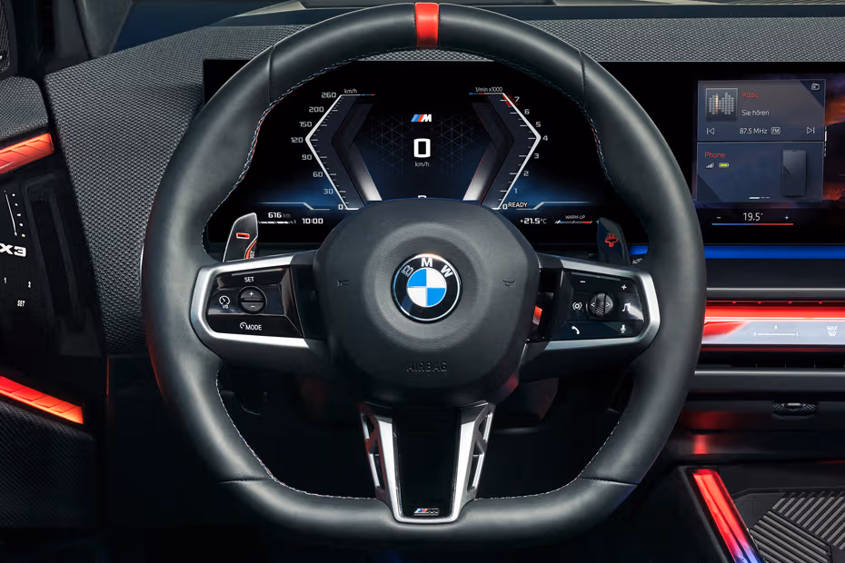 BMW X3 2026 SUV Steering wheel with paddle shifters close-up view BMW X3 2026 SUV Steering wheel with paddle shifters close-up view