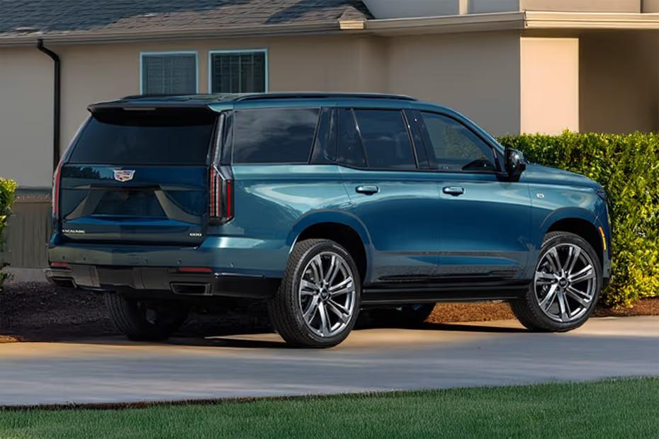 Cadillac Escalade 2026 Rear Left Side Angle View Showing Taillights, Tailgate and Alloy Wheels Cadillac Escalade 2026 Rear Left Side Angle View Showing Taillights, Tailgate and Alloy Wheels