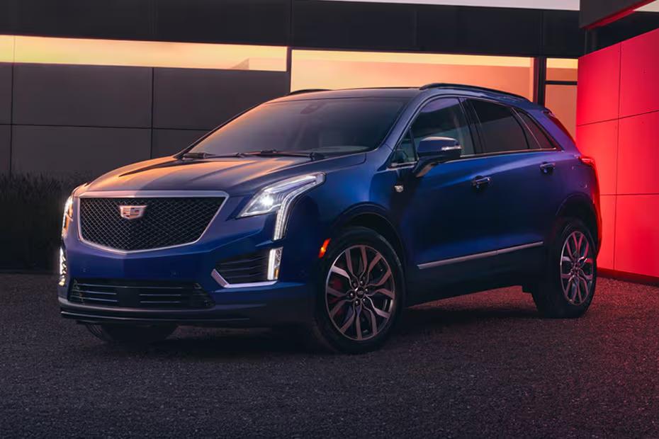 Cadillac XT5 2026 SUV Front left side angle view on city street Cadillac XT5 2026 SUV Front left side angle view on city street