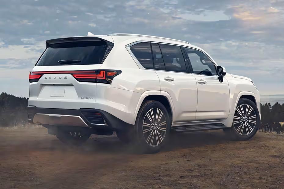 Lexus LX SUV 2026 Sonic Quartz rear three-quarter angle view showing taillights and alloy wheels Lexus LX SUV 2026 Sonic Quartz rear three-quarter angle view showing taillights and alloy wheels