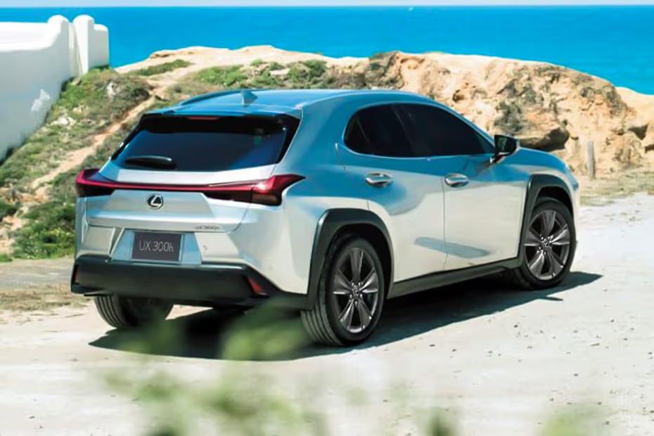 Lexus UX300H 2026 SUV Sonic Quartz Rear Left side angle view showing taillights Lexus UX300H 2026 SUV Sonic Quartz Rear Left side angle view showing taillights
