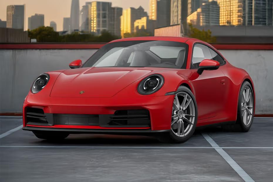 Porsche 911 2026 Front left side angle view showing headlights, front grille and alloy wheels Porsche 911 2026 Front left side angle view showing headlights, front grille and alloy wheels