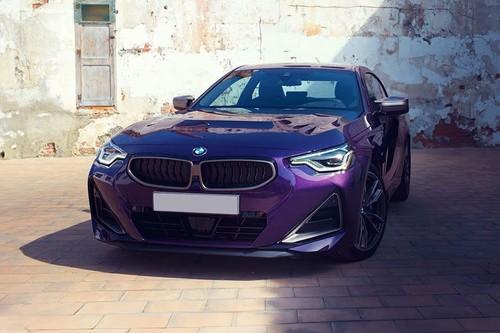 BMW 2 Series Purple Coupe front left side angle view showing headlights BMW 2 Series Purple Coupe front left side angle view showing headlights