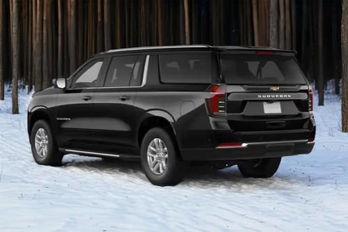 Chevrolet Suburban 2026 SUV Rear Left side angle view showing taillights, tailgate and alloy wheels Chevrolet Suburban 2026 SUV Rear Left side angle view showing taillights, tailgate and alloy wheels