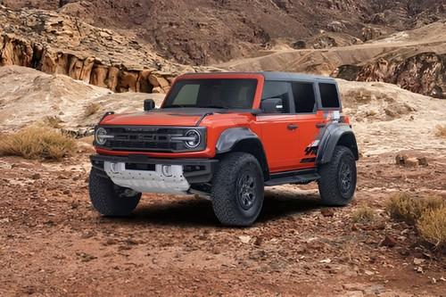 Ford Bronco Raptor 2026 Code Orange SUV Front Right Side Angle View on City Street Ford Bronco Raptor 2026 Code Orange SUV Front Right Side Angle View on City Street