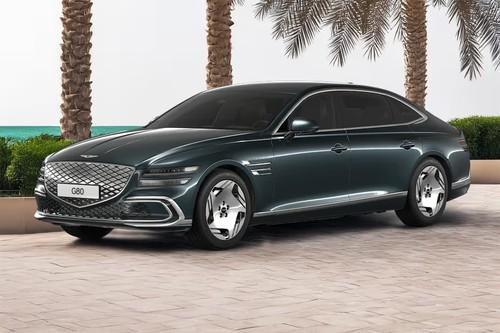 Genesis EV G 80 Hallasan Green Sedan front right side angle view on city street Genesis EV G 80 Hallasan Green Sedan front right side angle view on city street
