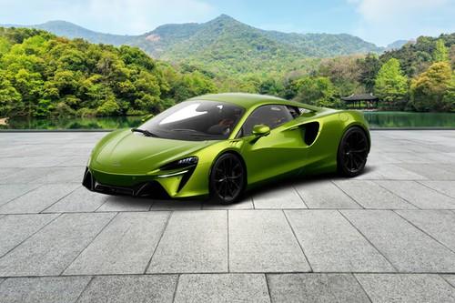McLaren Artura 2026 Green Coupe front right side angle view on city street McLaren Artura 2026 Green Coupe front right side angle view on city street