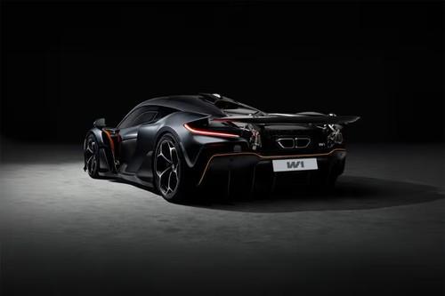 McLaren W1 Black Coupe Rear Left side angle view showing taillights, tailgate and alloy wheels McLaren W1 Black Coupe Rear Left side angle view showing taillights, tailgate and alloy wheels