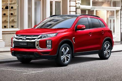 Mitsubishi ASX SUV Front right side angle view on city street Mitsubishi ASX SUV Front right side angle view on city street