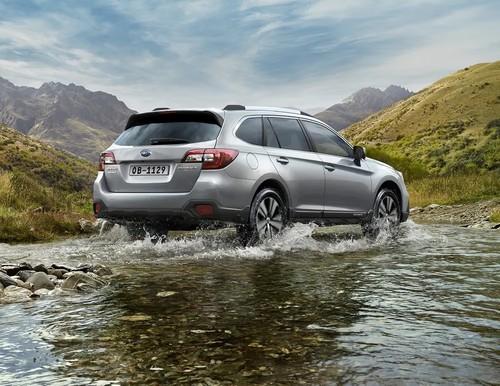 Subaru Outback SUV rear left side angle view showing taillights, tailgate and alloy wheels Subaru Outback SUV rear left side angle view showing taillights, tailgate and alloy wheels