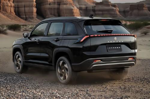Suzuki Across 2026 Bluish Black SUV Rear Left Side Angle View Showing Taillights, Tailgate and Alloy Wheels Suzuki Across 2026 Bluish Black SUV Rear Left Side Angle View Showing Taillights, Tailgate and Alloy Wheels