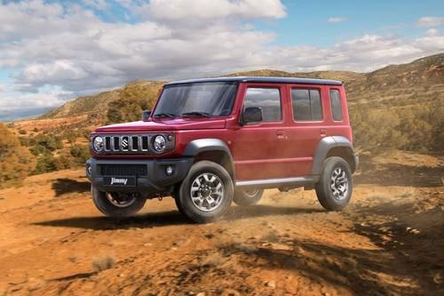 Suzuki Jimny 5 Door 2025 SUV Front Right Side Angle View on City Street Suzuki Jimny 5 Door 2025 SUV Front Right Side Angle View on City Street