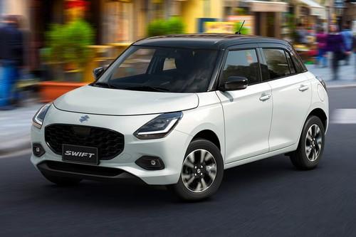 Suzuki Swift 2026 Hatchback Front right side angle view on city street Suzuki Swift 2026 Hatchback Front right side angle view on city street